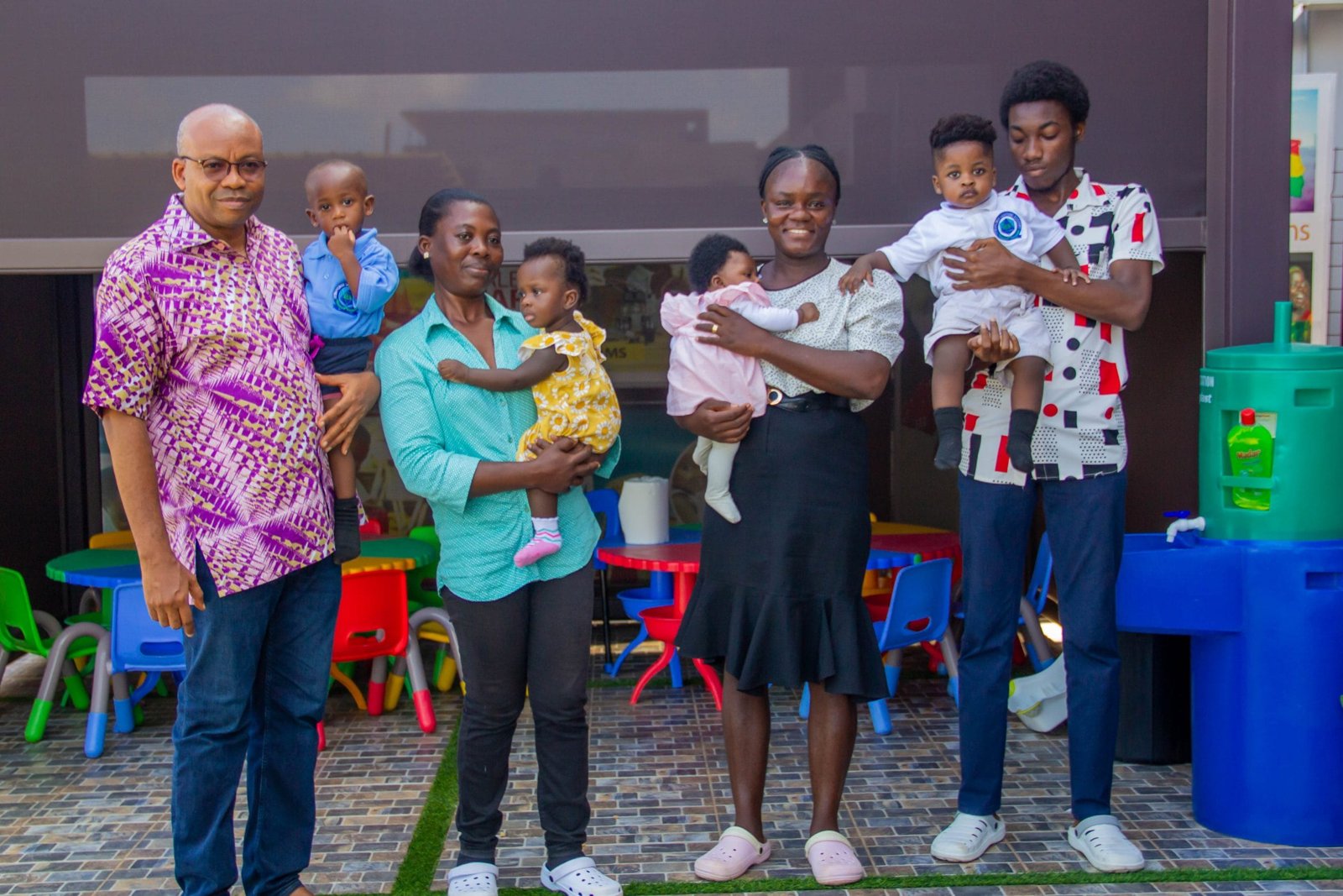 Gemsprings staff with parents and babies on the school playground